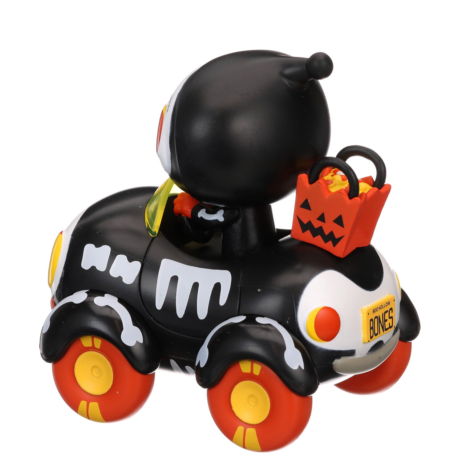 Black vinyl buggy figure with white bone decals, orange wheels, and jack-o-bag accessory