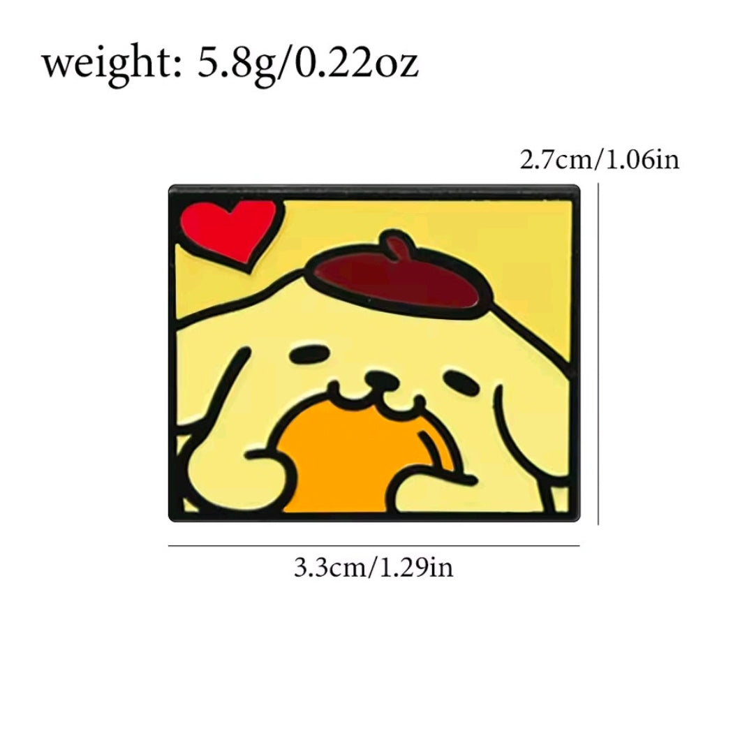 Pompompurin enamel pin with yellow dog face and orange treat, black border