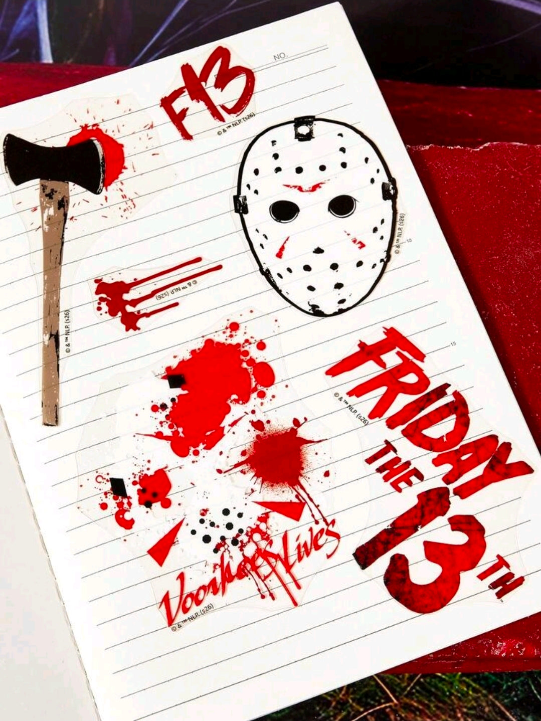 Nail art sticker sheet with Jason-style hockey mask and axe splatter graphics