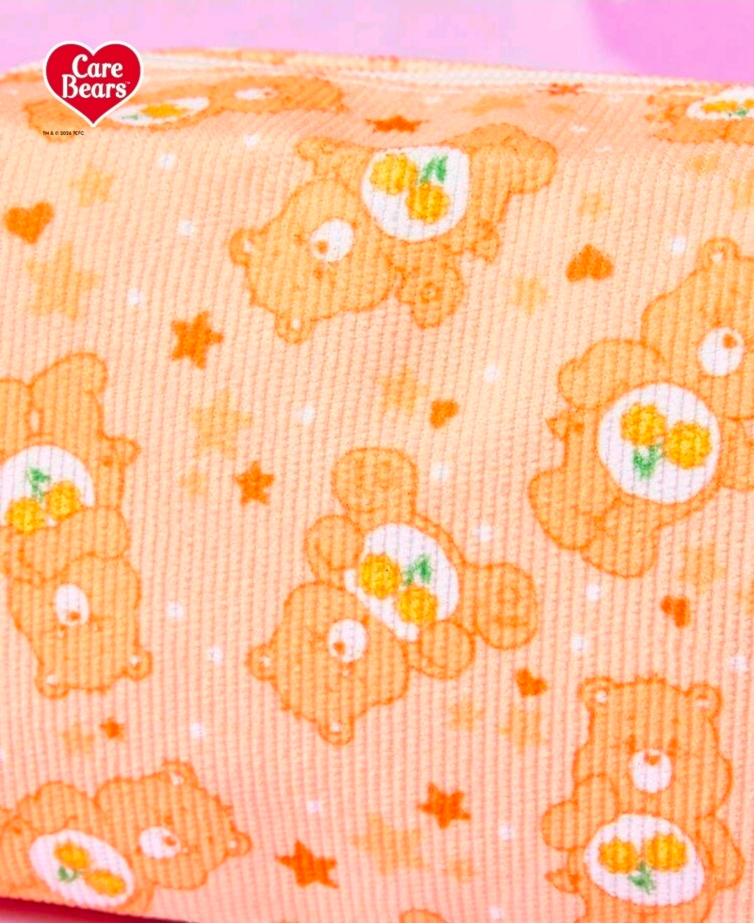 Orange corduroy fabric with Care Bears bear and star print pattern
