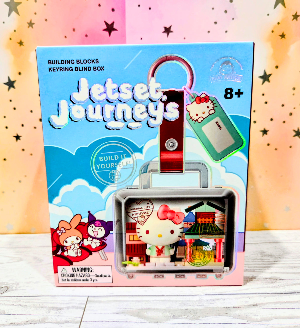 Jetset Journeys building block keychain box with keyring holder and '8+'