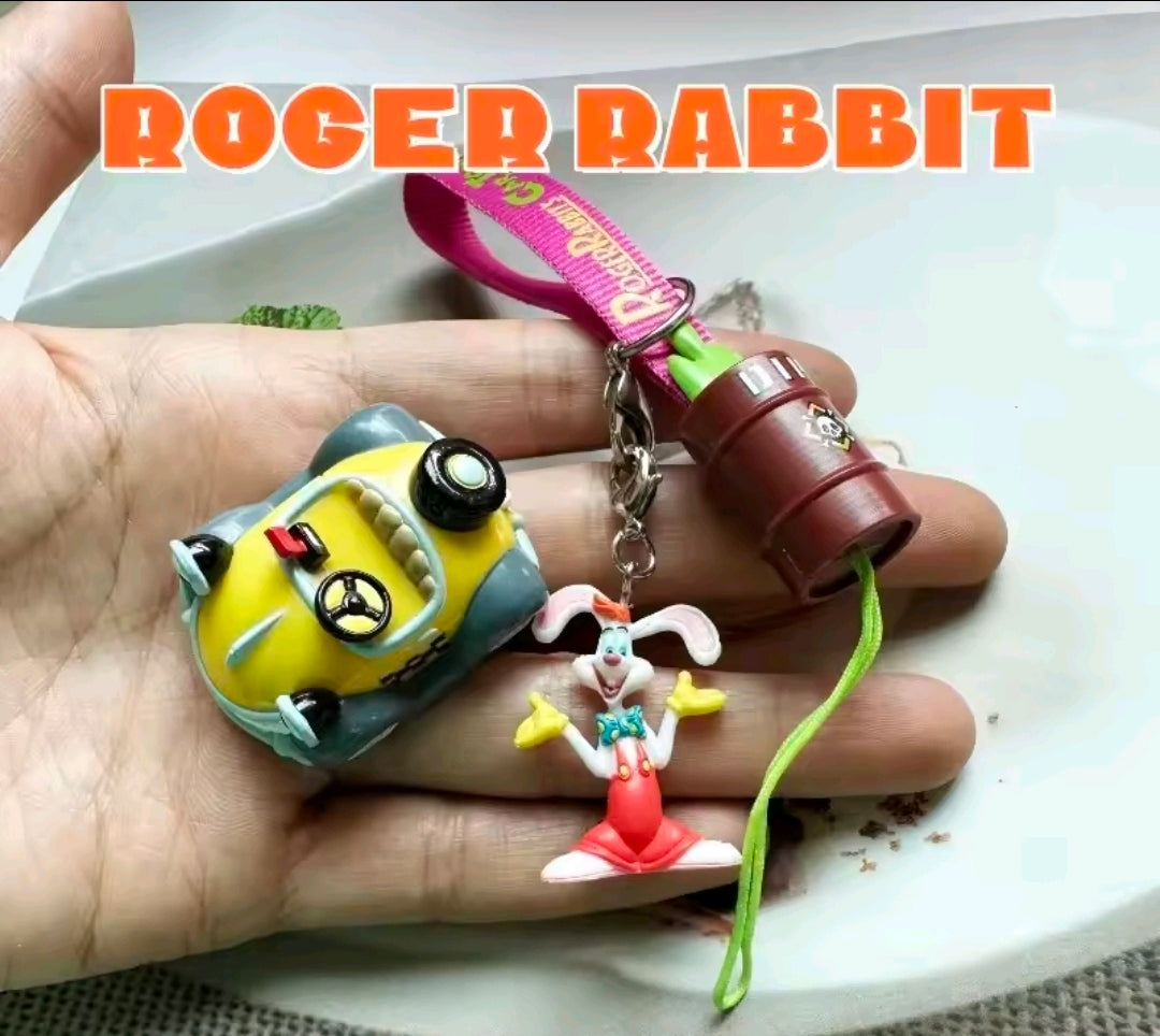 Benny Cab charm keychain on palm with hanging lanyard and rabbit charm