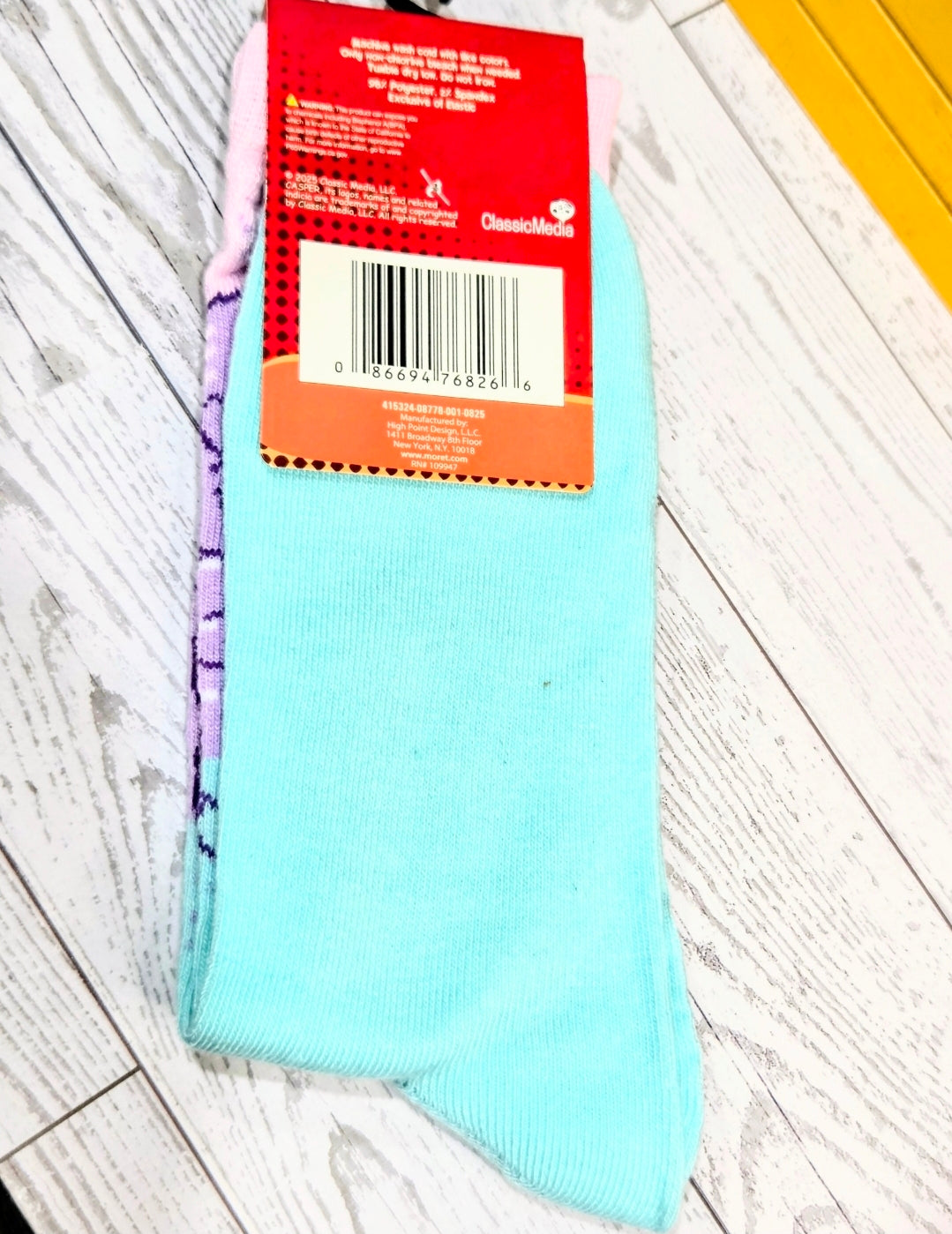 Crew socks in light blue with purple contrast seams at toe