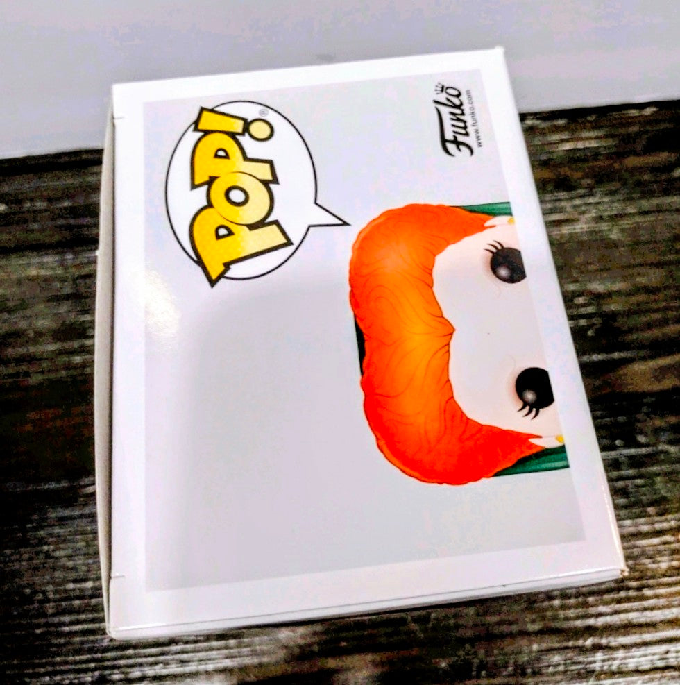 Boxed Funko Pop vinyl figure with orange hair and partial face visible