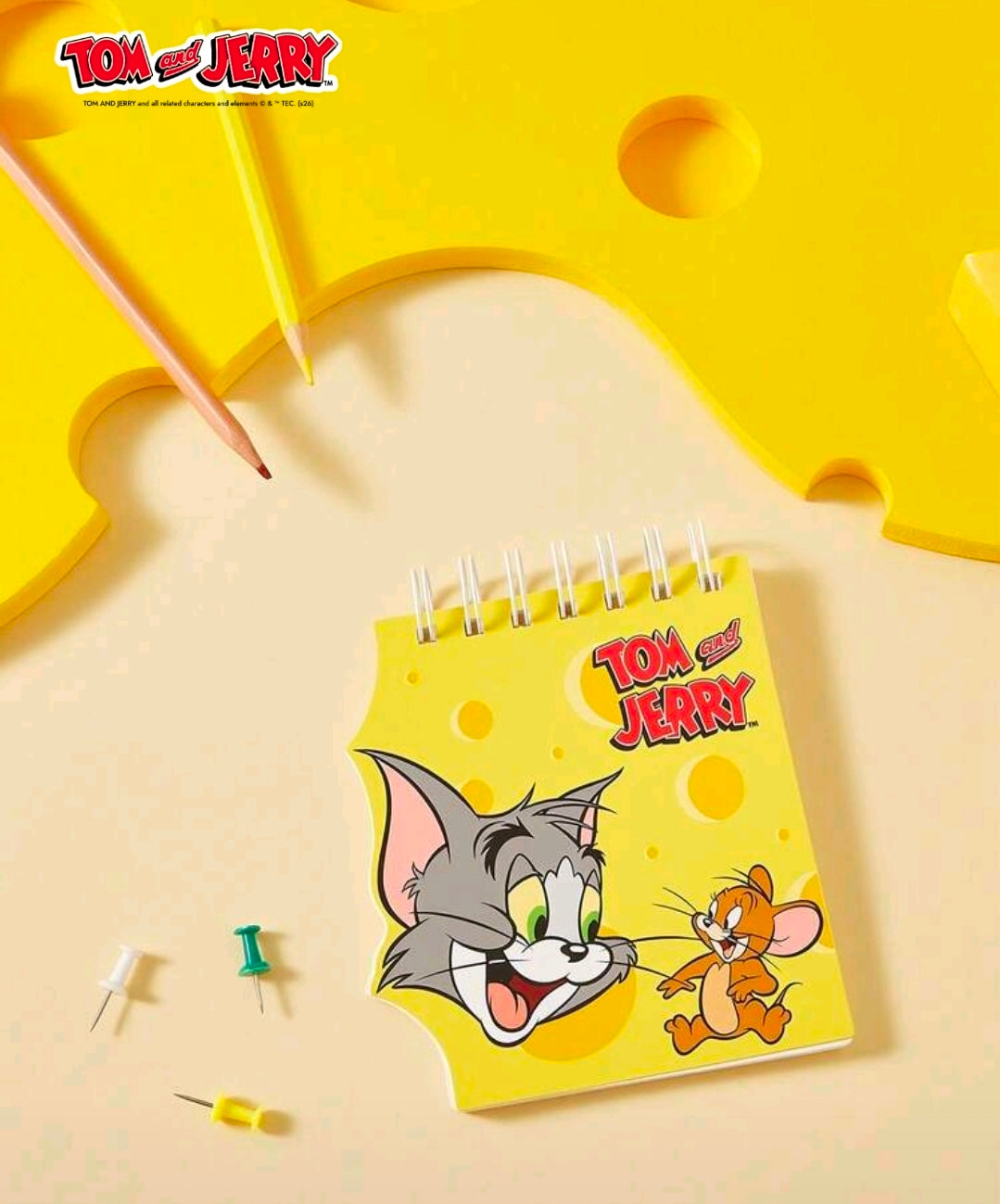 Mini spiral notepad with yellow Tom and Jerry cover and spiral rings