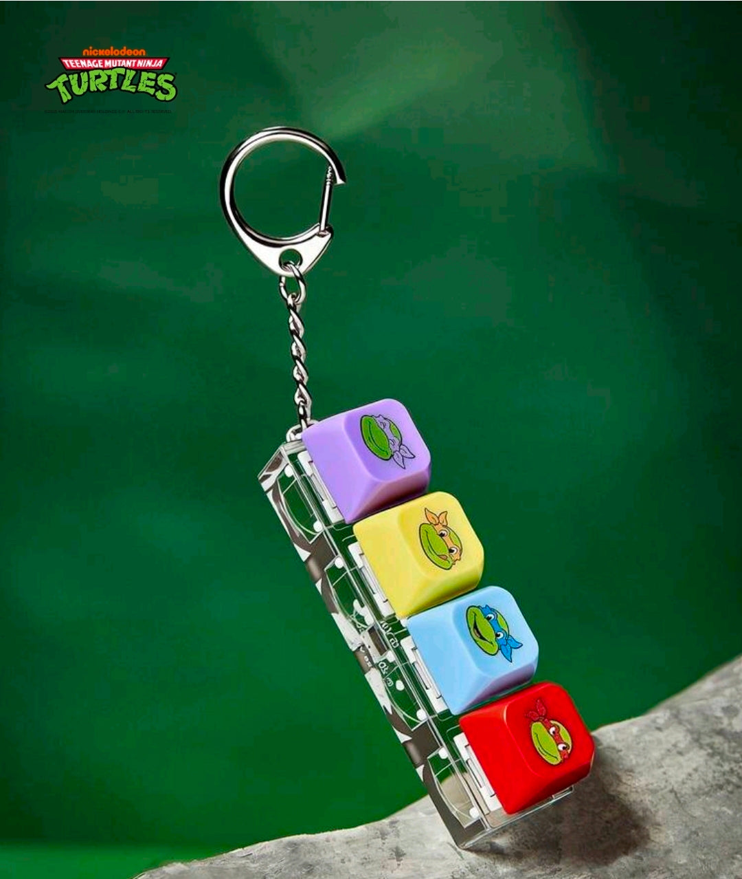 TMNT keyboard clicker keychain with metal chain and four colorful turtle keycaps