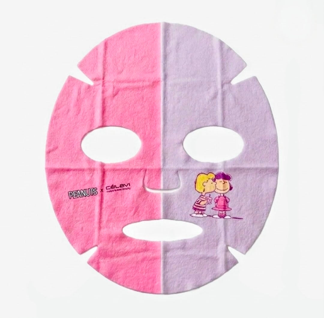 Dual face mask sheet with pink and purple halves, featuring Snoopy and Charlie Brown art