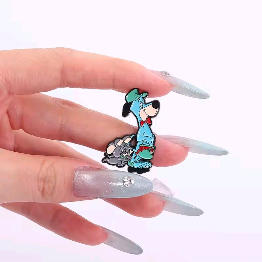 Enamel pin of blue Huckleberry Hound holding a gray hound
