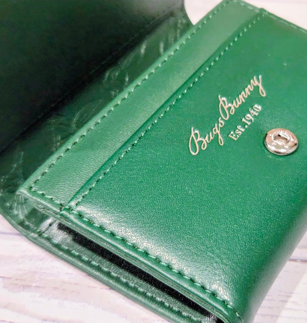 Green interior panel with script Bugs Bunny logo and silver snap button