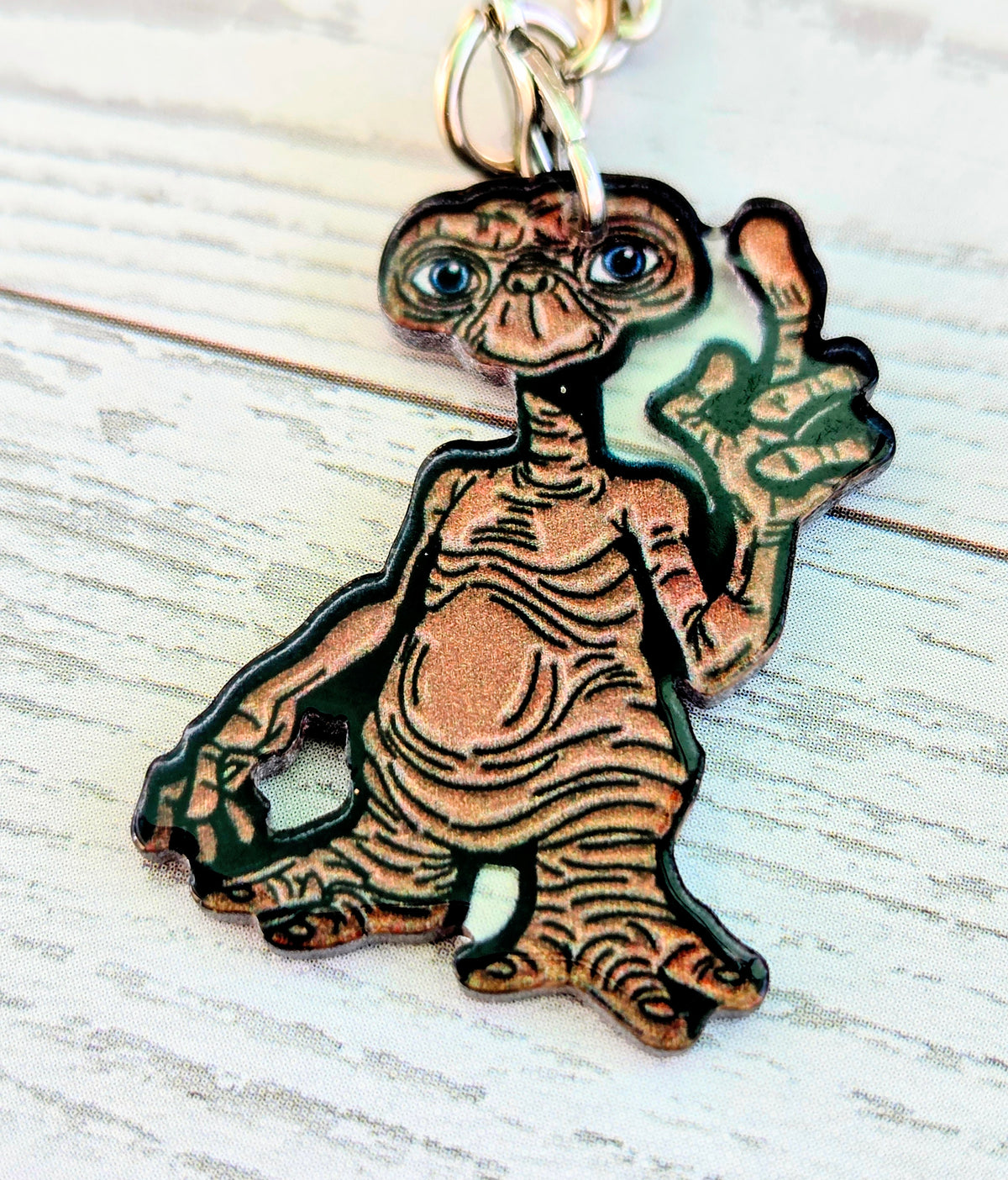 Acrylic E.T. die-cut keychain with gold ring, detailed alien figure with blue eyes