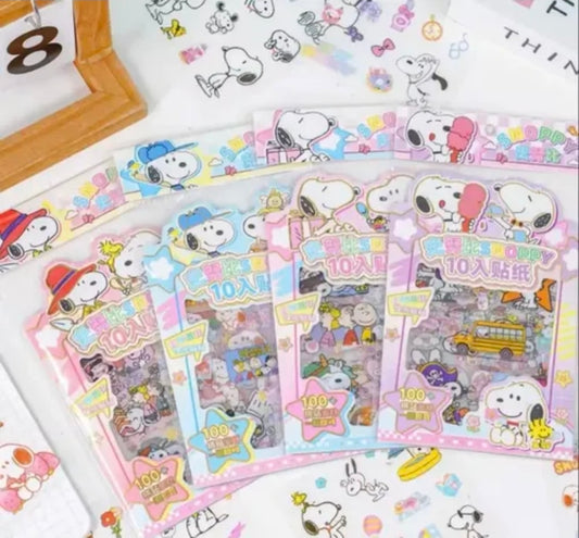 Assorted Snoopy sticker packs laid out, each showing a front card design