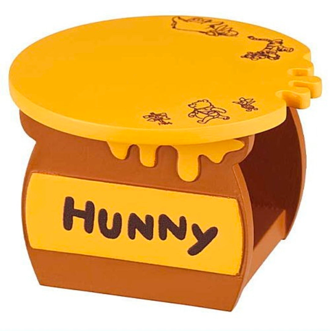 Small yellow-and-brown Hunny storage table with “HUNNY” label on front