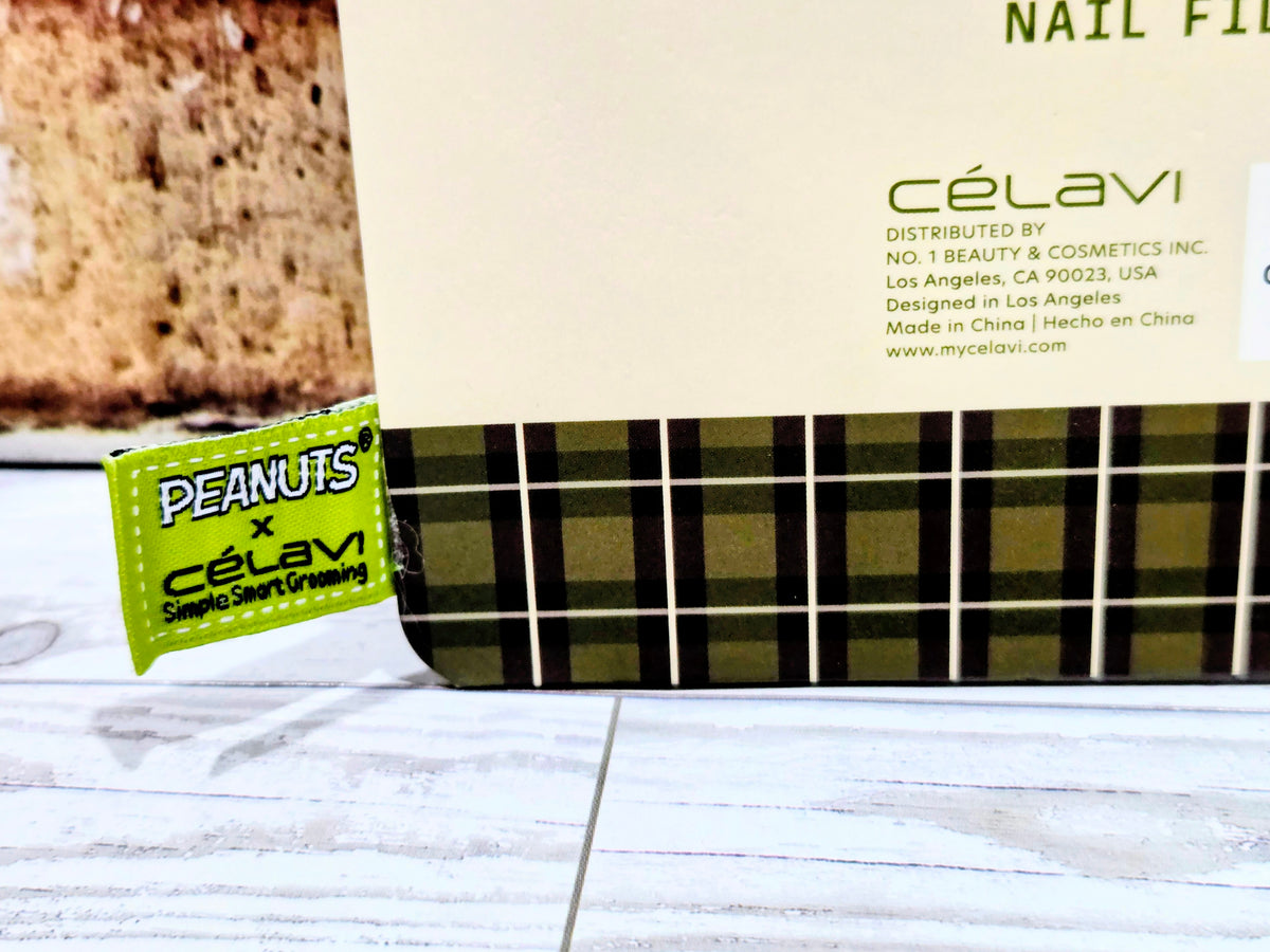 Green plaid manicure case with Peanuts x Celavi logo patch
