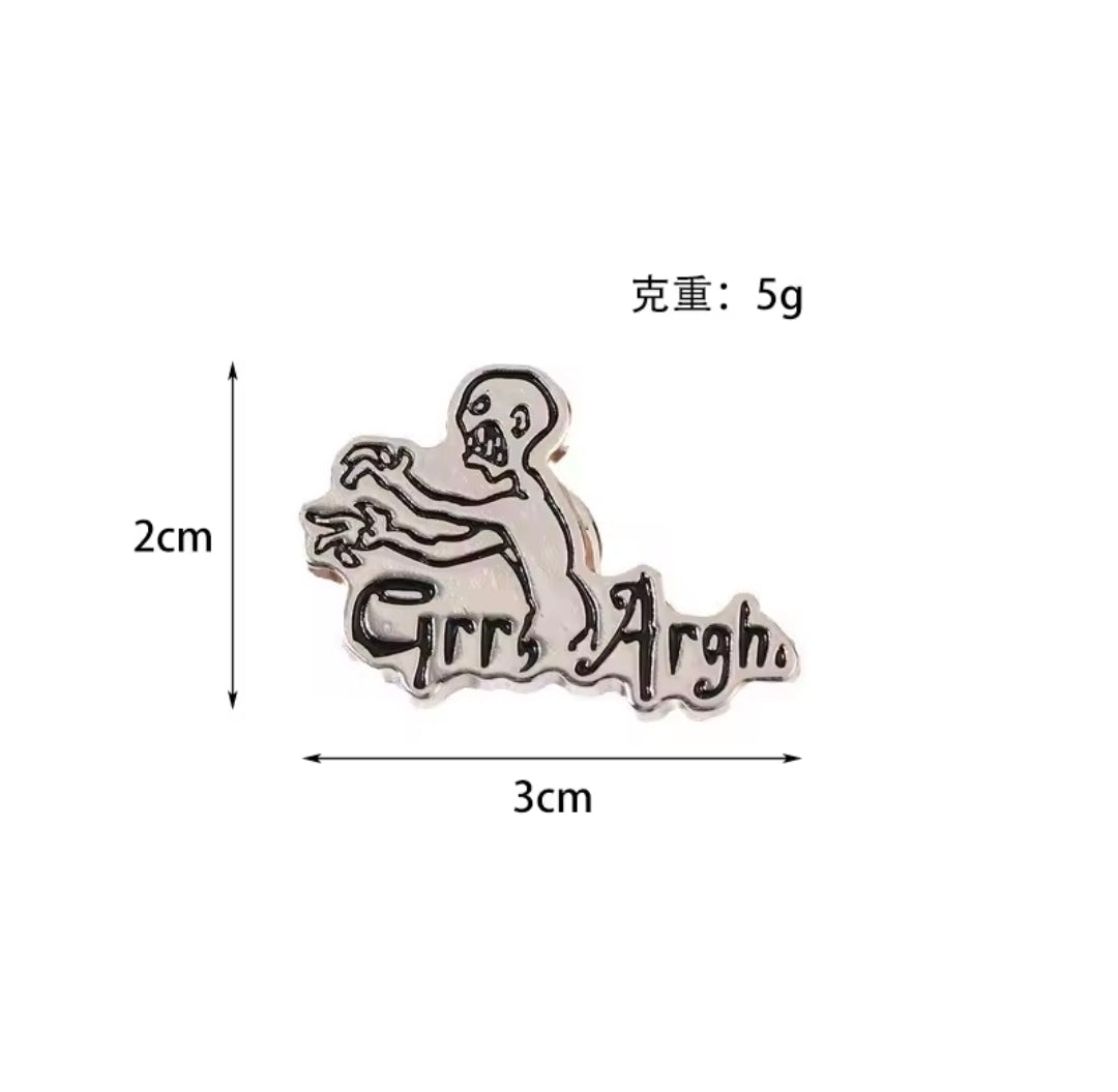 Grr Argh enamel lapel pin with vampire slayer figure and “Grr Argh” text, silver-tone