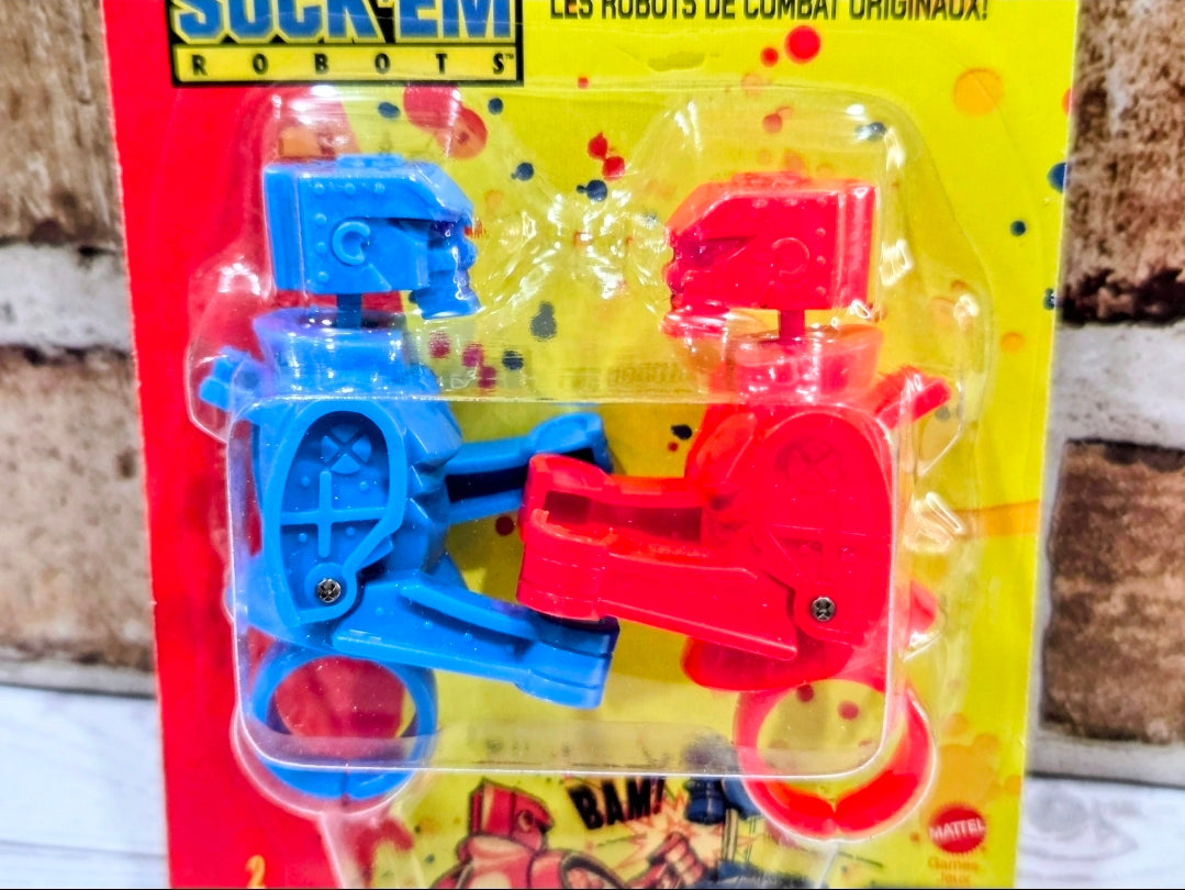 Blister pack showing blue and red robot finger rings