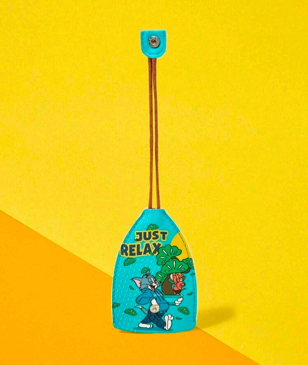Turquoise Tom & Jerry key fob holder with “Just Relax” graphic and strap loop