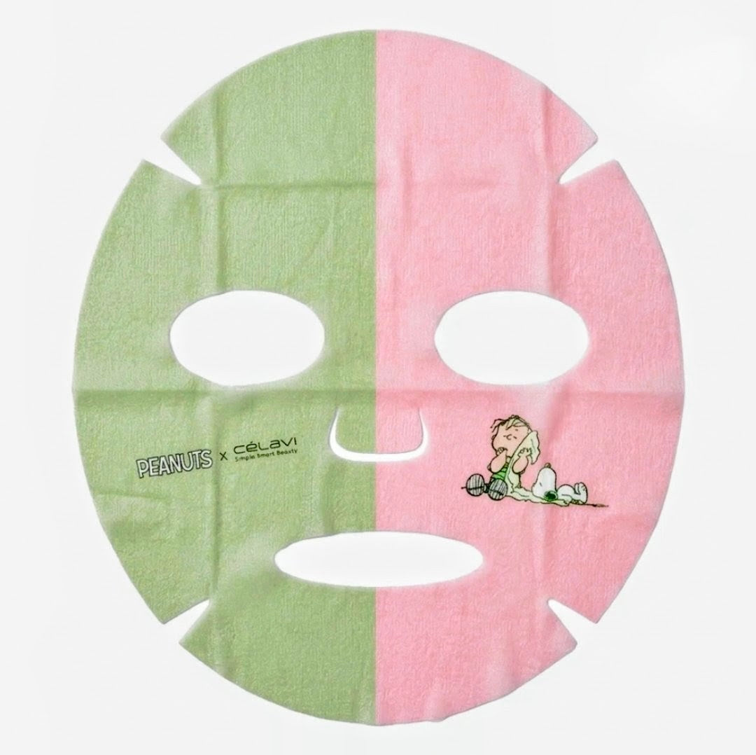 Dual face mask sheet with green and pink halves, featuring Snoopy and Charlie Brown art