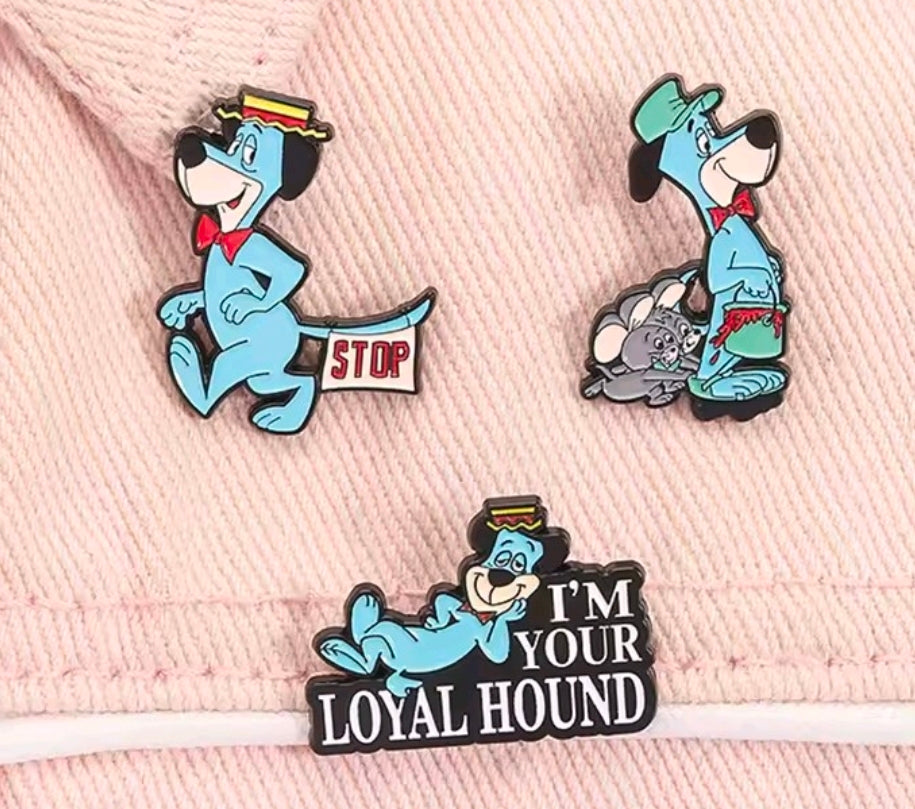 Enamel pins on pink fabric hat: STOP, gray-hound scene, and I’m Your Loyal Hound