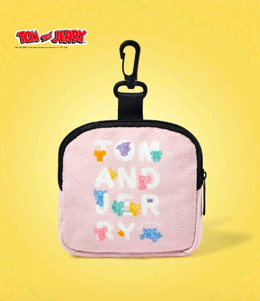 Pink mini zip coin pouch with pastel character-and-letter pattern, black top loop
