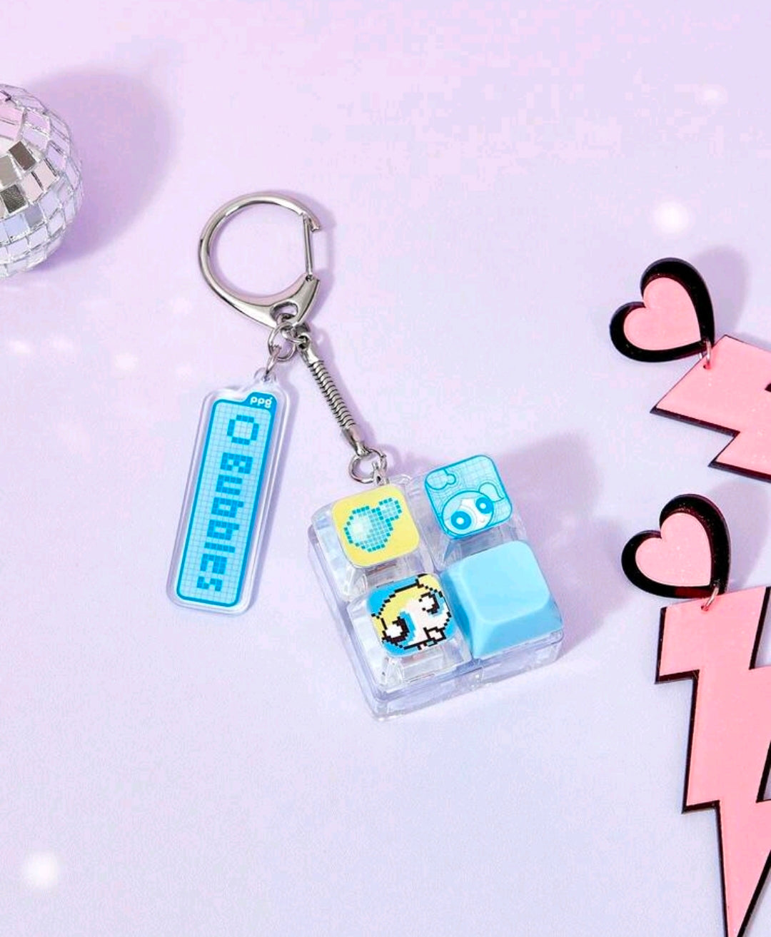 Blue fidget keychain with keyboard clicker charm and clear character block fidget pieces