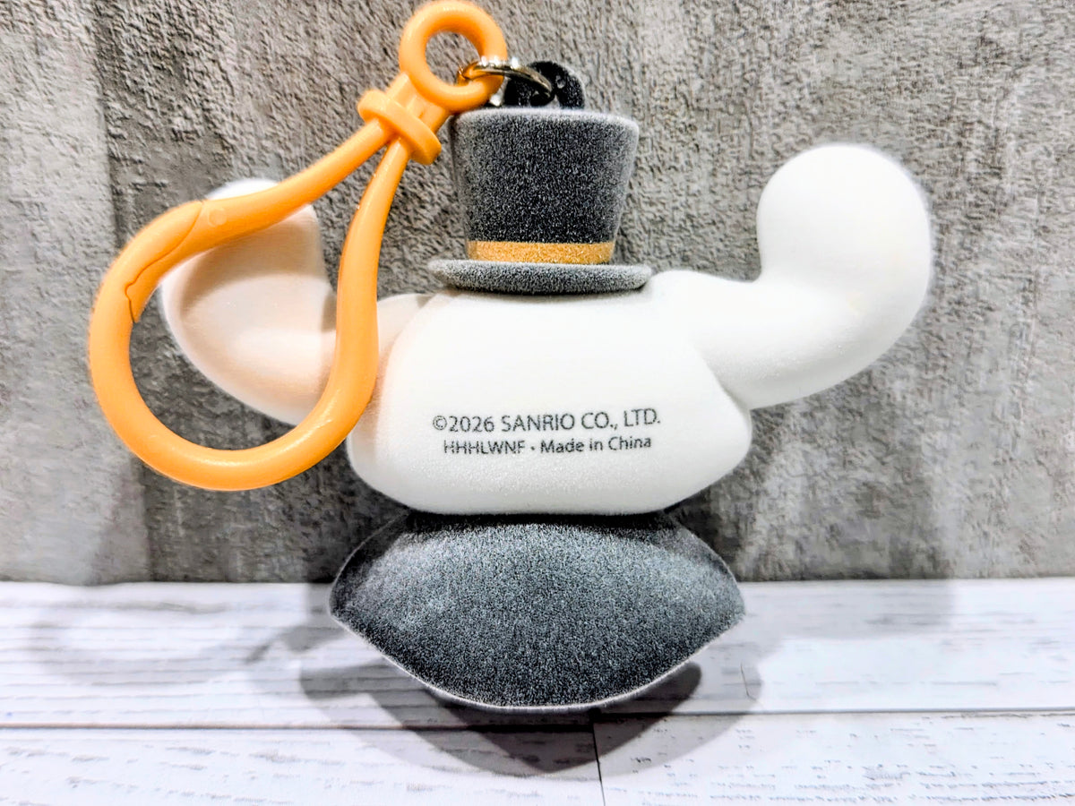 Flocked Cinnamoroll bag clip with orange loop and dark gray top hat