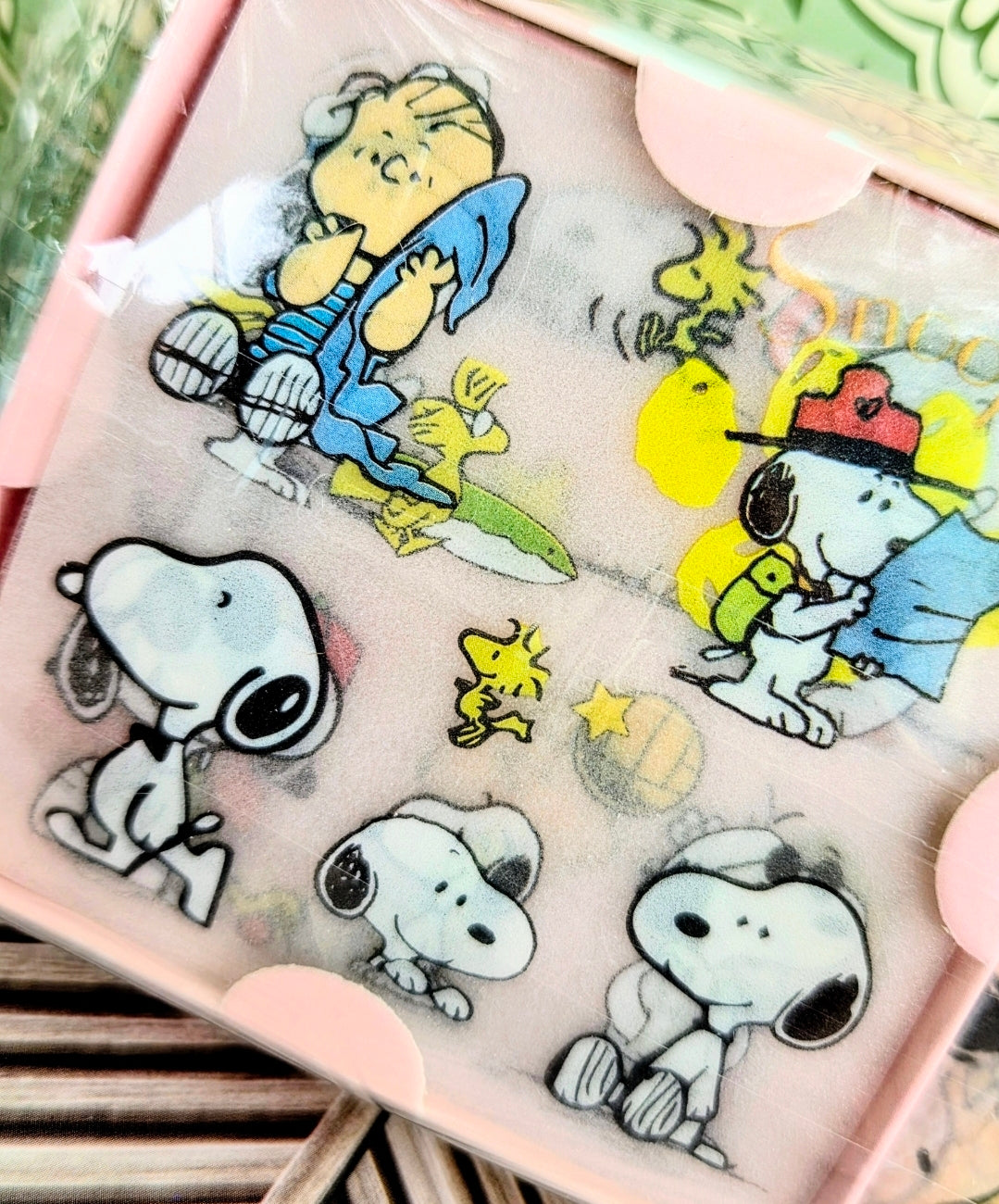Peanuts sticker sheet close-up with Snoopy characters, stars, and pastel scenes
