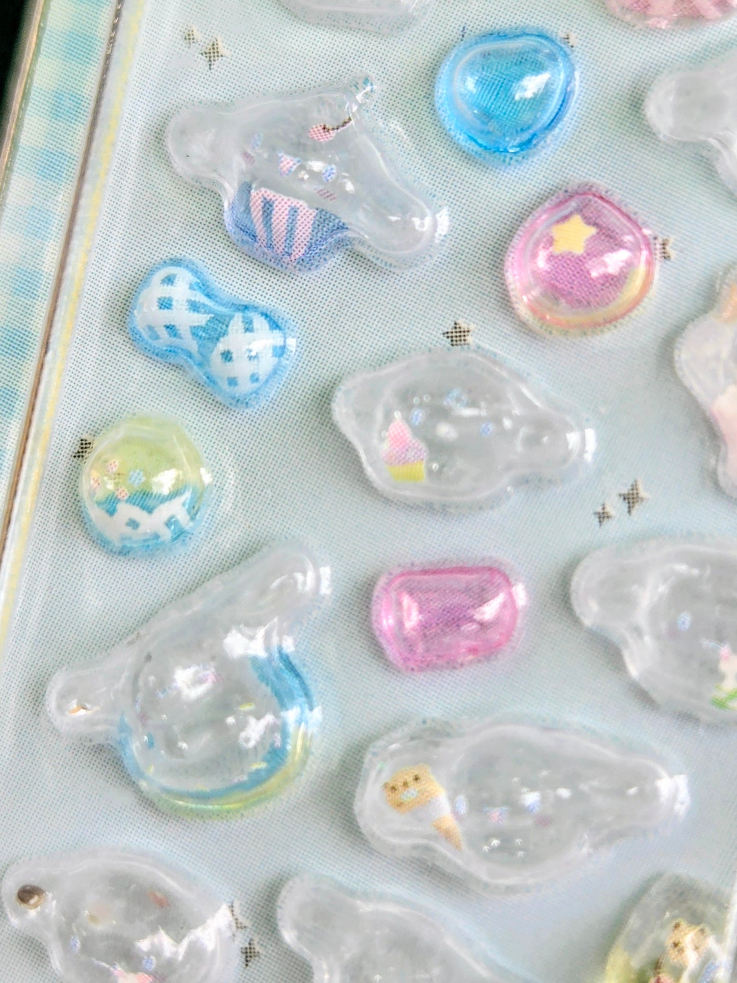Set of clear 3D Sanrio-themed drop stickers in mixed shapes and pastel colors.