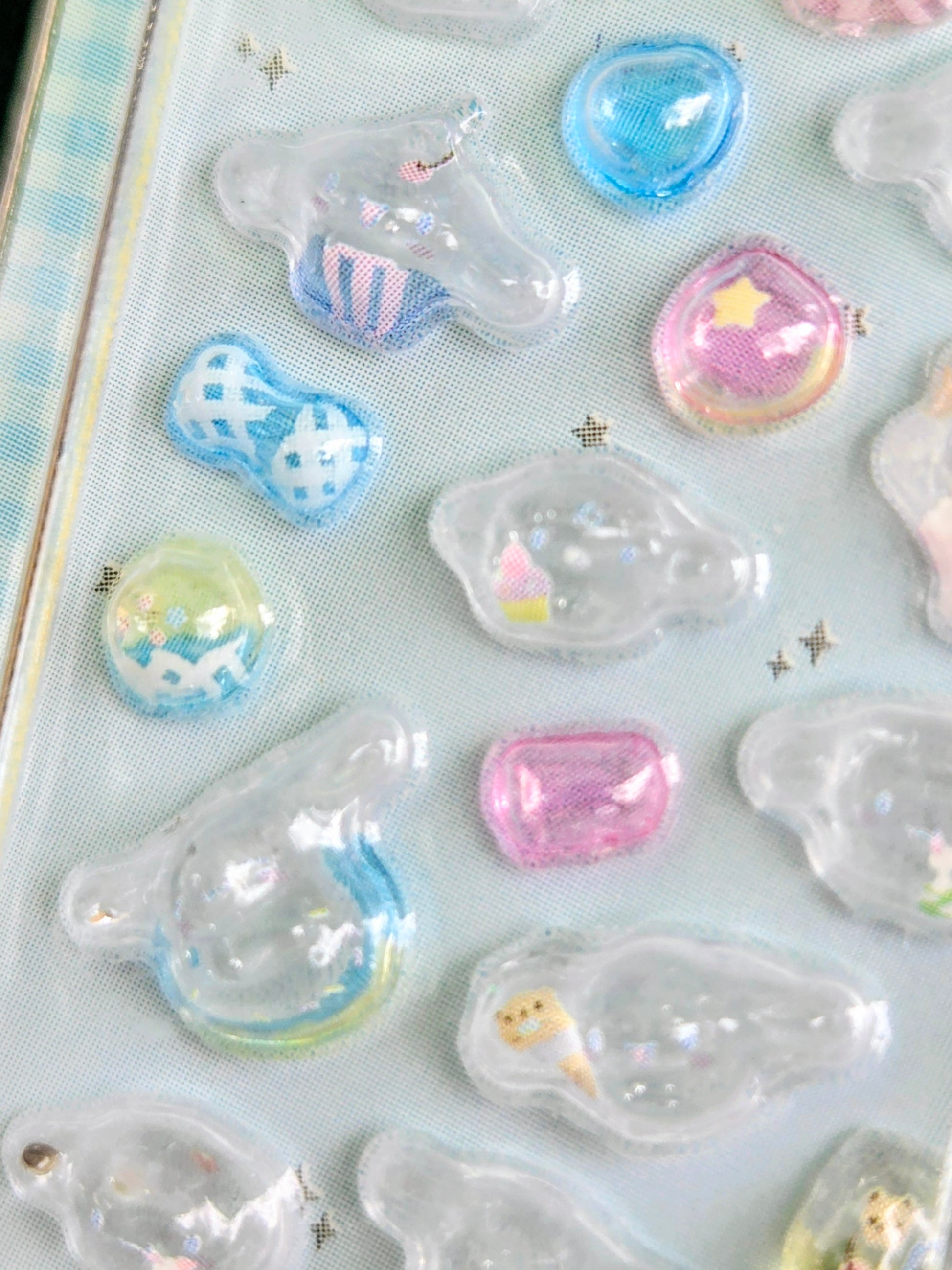 Set of clear 3D Sanrio-themed drop stickers in mixed shapes and pastel colors.