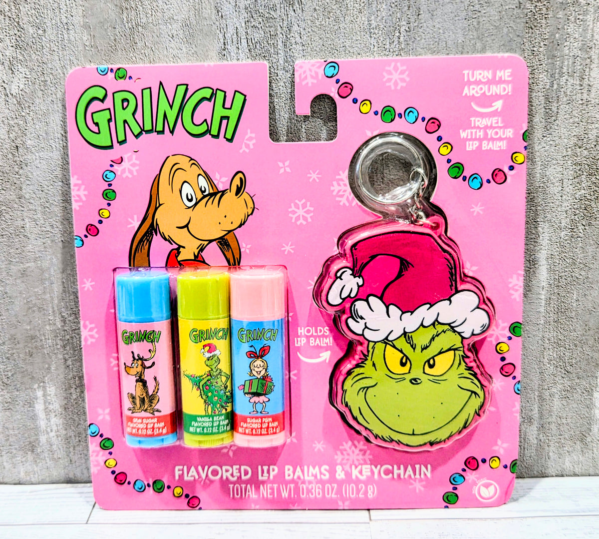 Flavored lip balm set with three lip balm tubes and Grinch keychain charm