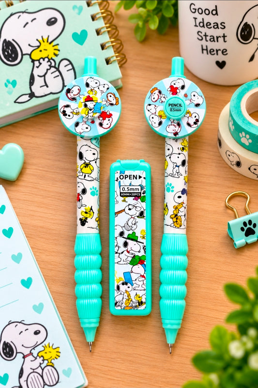 Two turquoise Snoopy-pattern mechanical pencils on desk with matching stationery