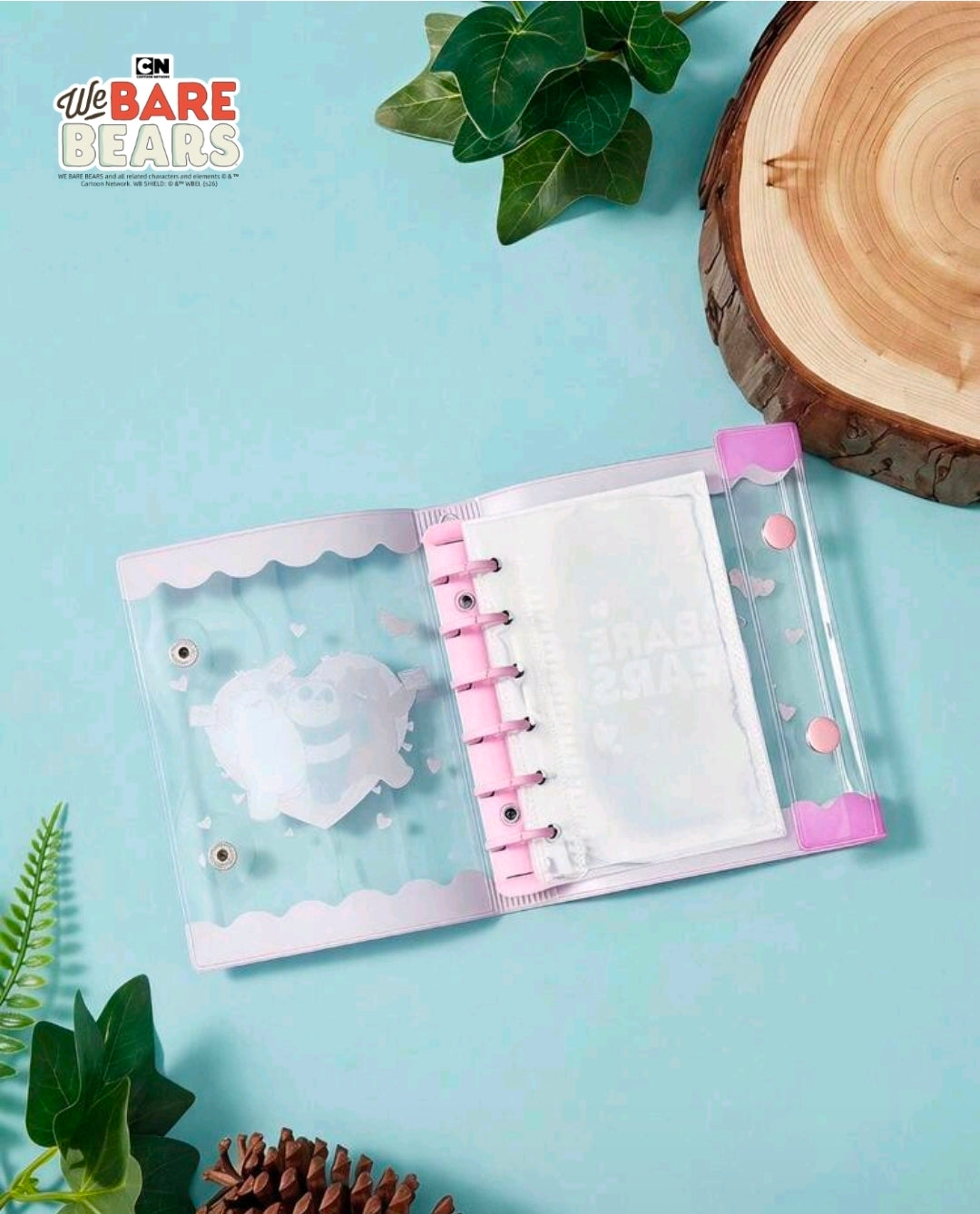 Mini photocard binder opened flat, transparent pockets, pink ring posts and snap frame.
