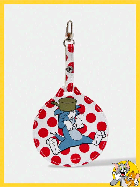 Round fabric bag charm with a blue cat and red polka dots, hanging on a metal key ring