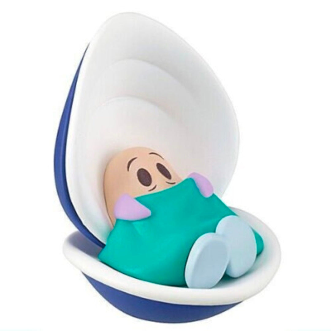 White rabbit gashapon figure sitting in white-blue bowl, holding green cloth
