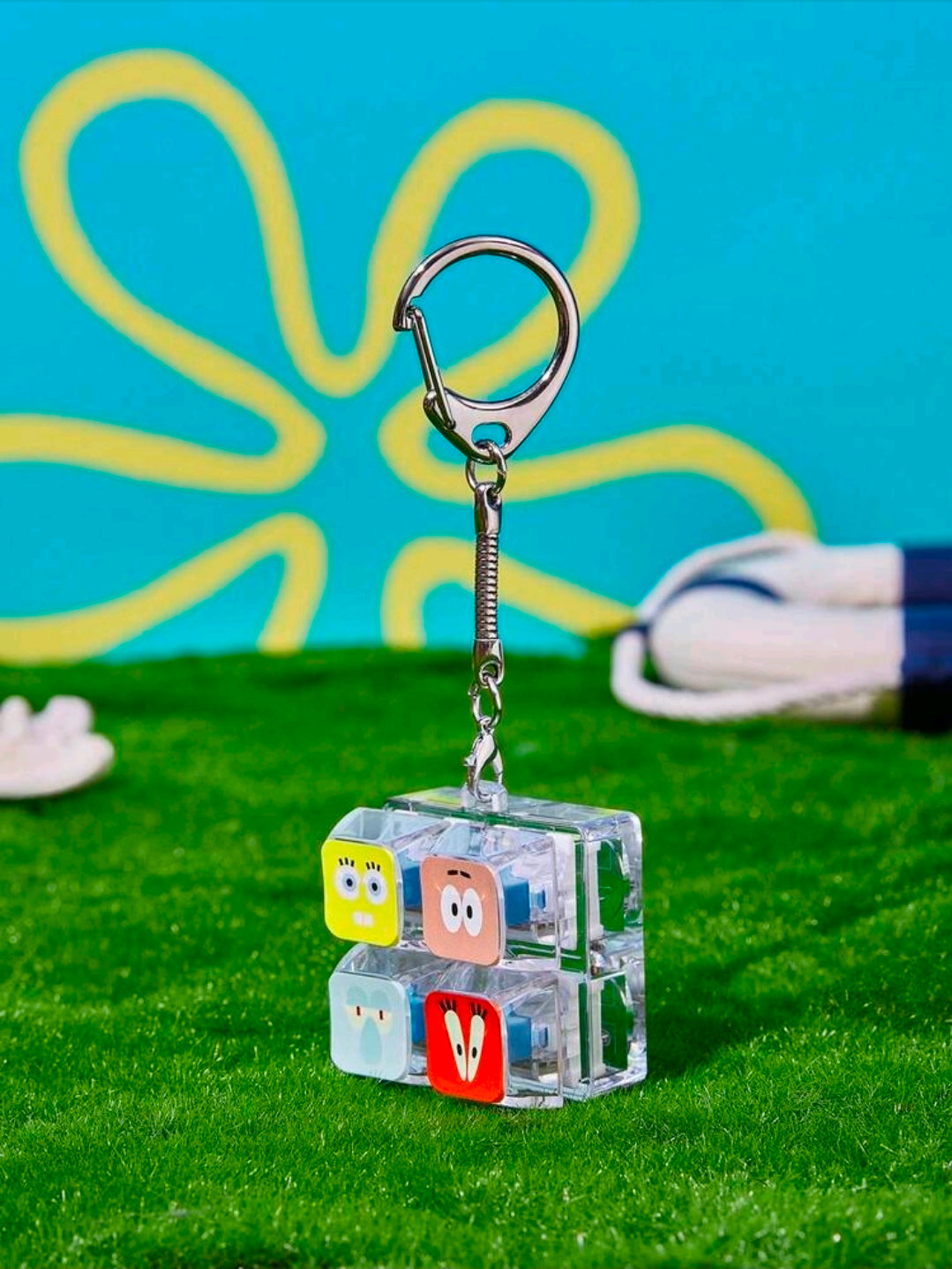 Clear 2x2 SpongeBob fidget keychain charm with metal keyring and four character tiles