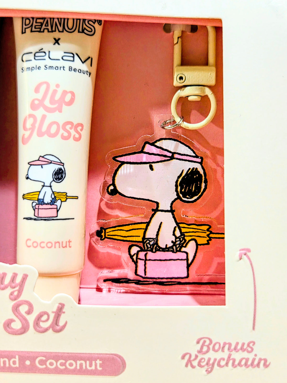 Lip gloss set gift box with bonus acrylic keychain shaped like Snoopy on a surfboard
