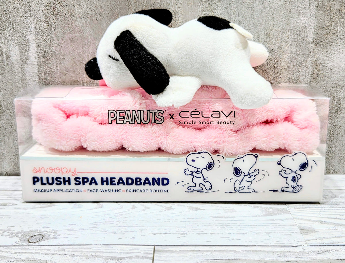 Snoopy plush spa headband on retail packaging with white fur and pink band