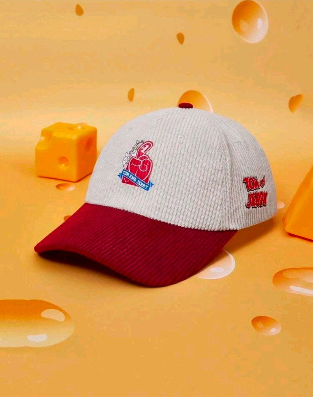 Light gray and burgundy baseball cap with Tom & Jerry patch and side emblem