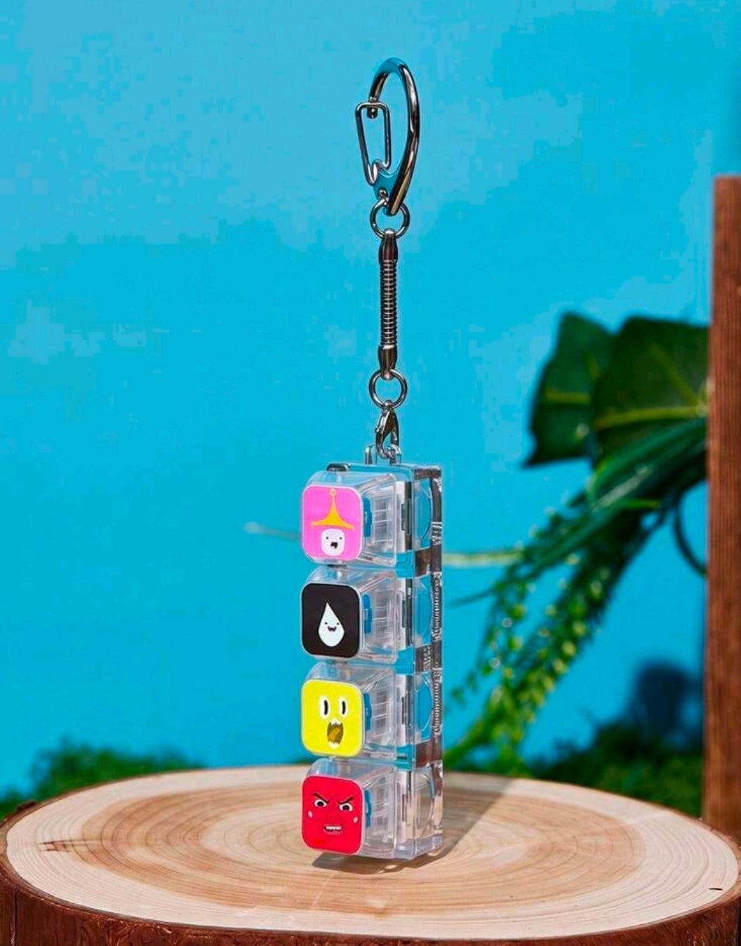 Stacked cube fidget keychain with four colorful character faces