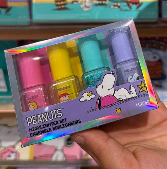 Peanuts glitter highlighter set box with four colored pens, including Snoopy design.
