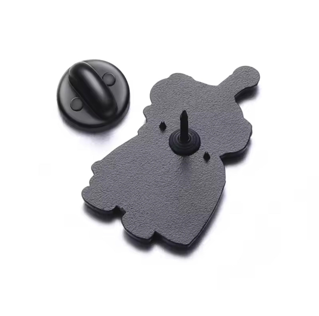 Dark gray Nibbler enamel pin with black metal backing