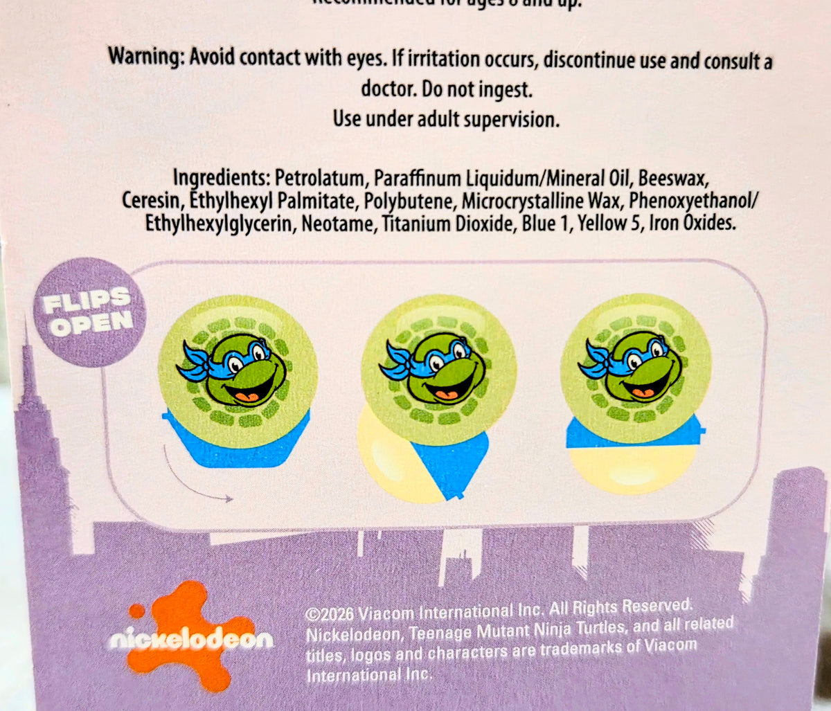 Lip balm information panel with use instructions and ingredient list icons
