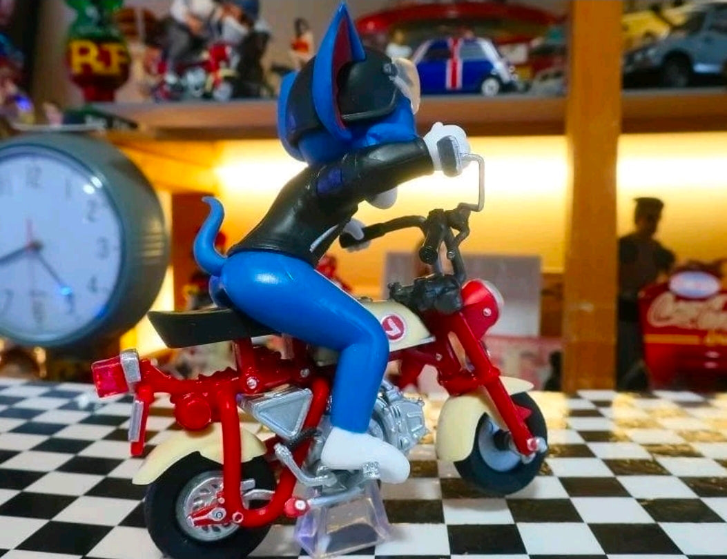 Biker Tom figure on red motorcycle with front headlight and chrome engine details