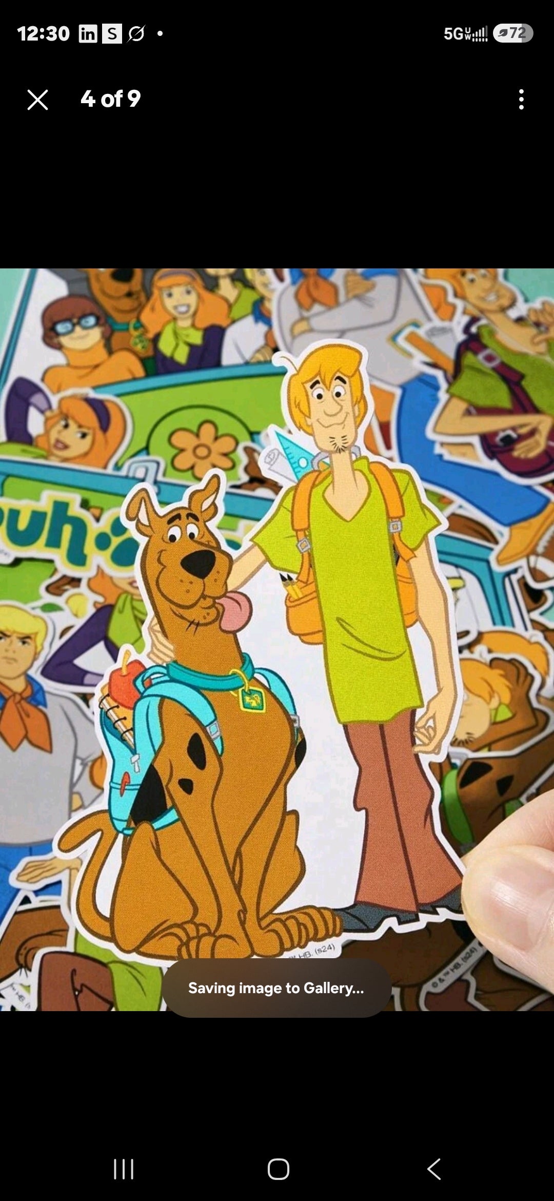 Scooby-Doo sticker sheet page with hand holding character and car scene
