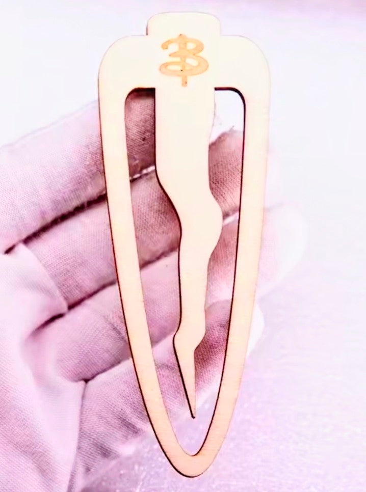 Wood stake bookmark shaped like a dagger with small crest symbol on top
