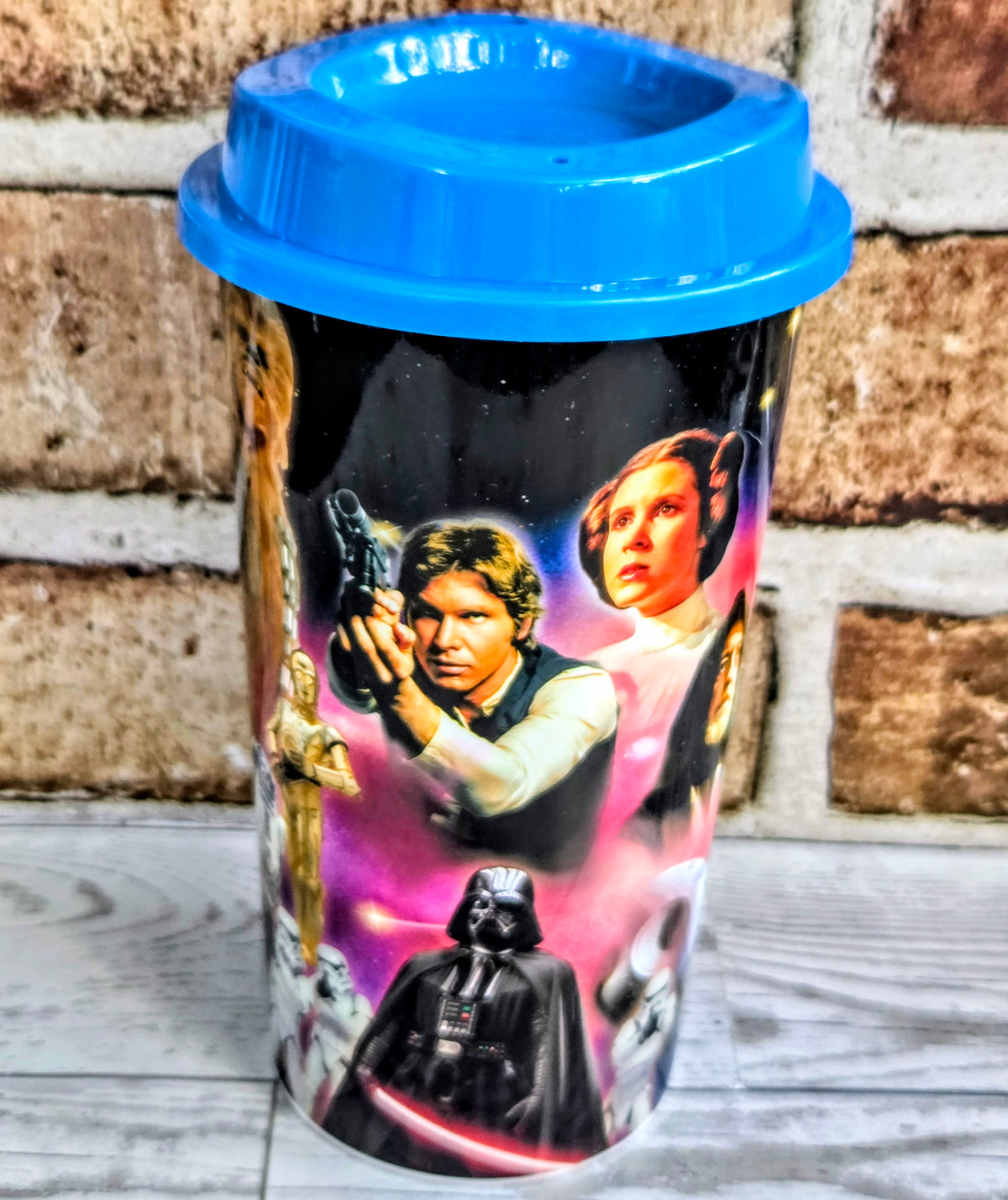 Blue Star Wars plastic travel mug with character collage and snap lid