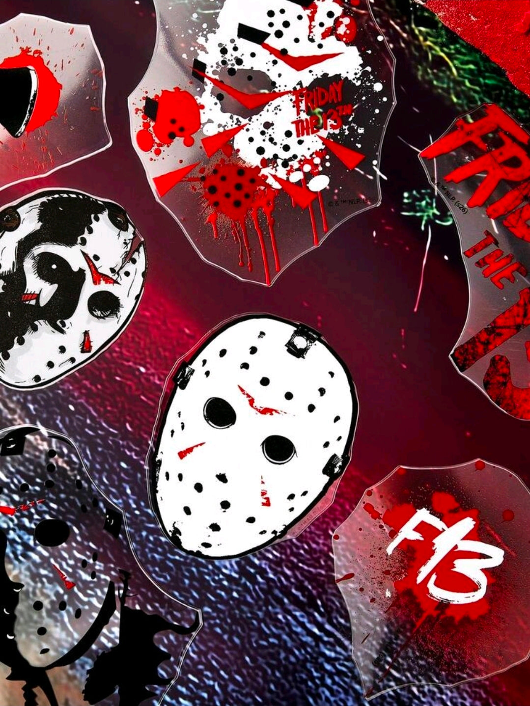 Assorted hockey mask themed stickers with red, white, and black splatter