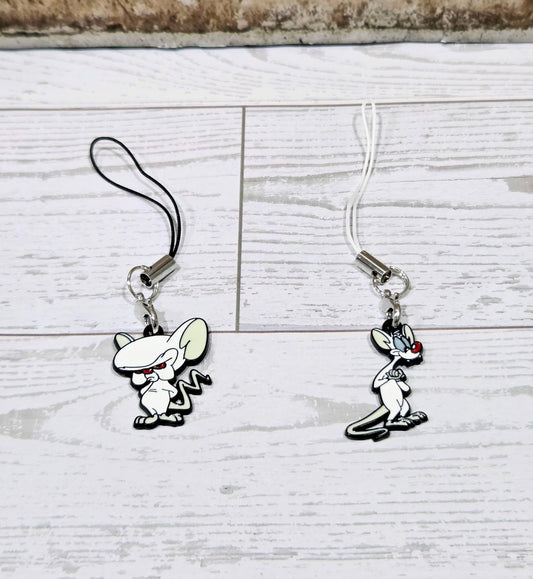 Two cartoon mouse phone keychain charms with silver hooks and black cords