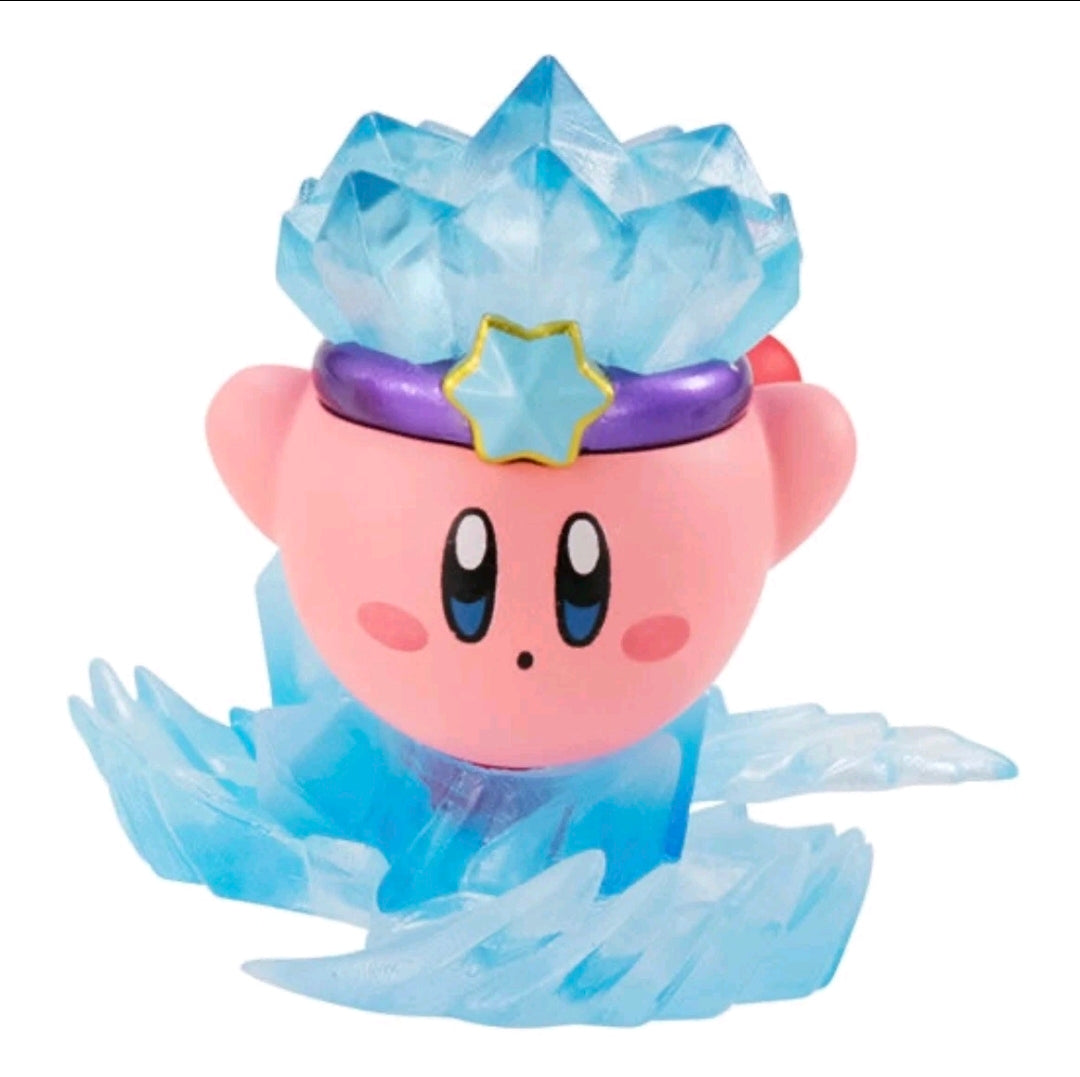 Kirby gashapon figure with blue crystal-like cape and star crown, pink face