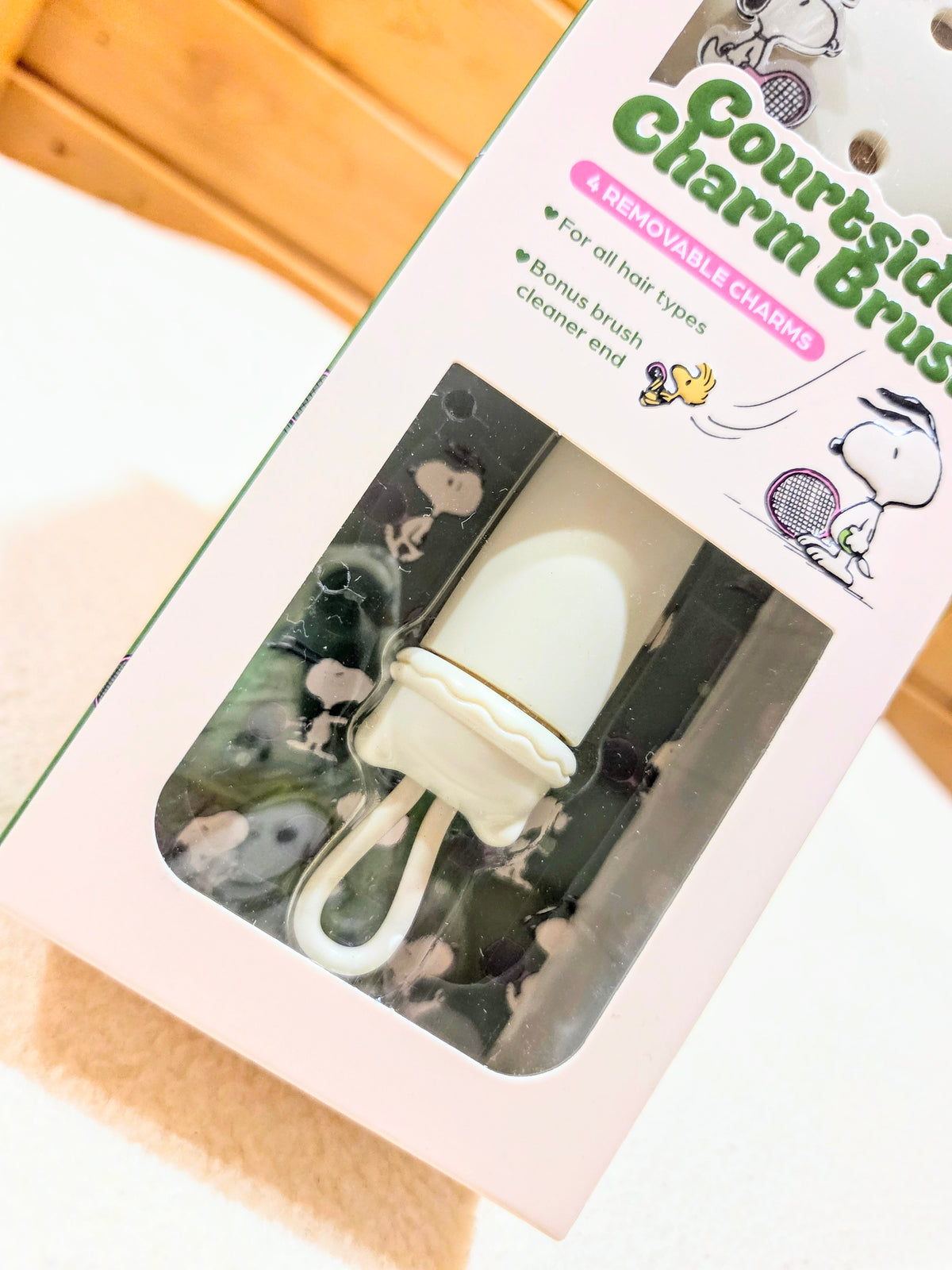 Clear blister tray showing included brush pieces and small face mask