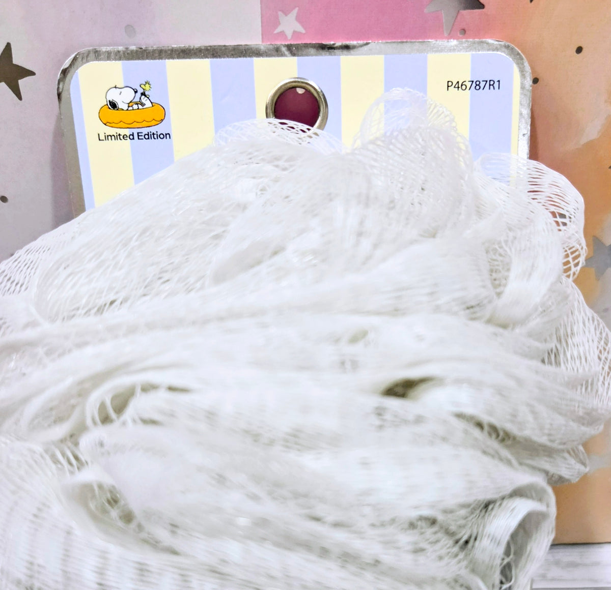 Celavi Snoopy exfoliating loofah bath sponge with fluffy white texture
